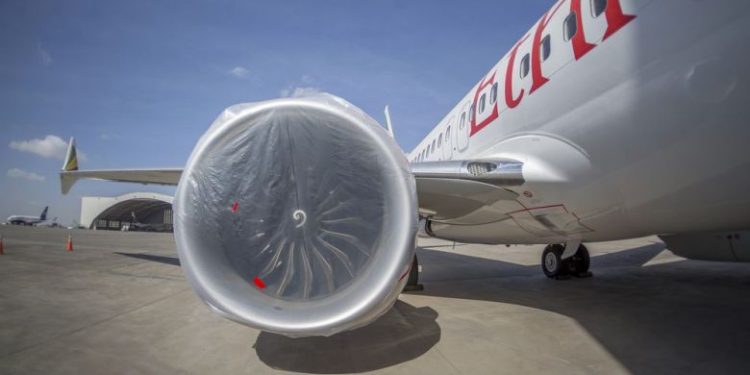 An Ethiopian Airlines Boeing 737 Max 8 sits grounded at Bole International Airport in Addis Ababa, Ethiopia. (Mulugeta Ayene / AP)