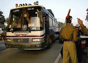 Passengers onboard the India-Pakistan 'friendship bus' under police guard at a rest stop in Sirhind, India, March 15, 2019. REUTERS/Alasdair Pal
