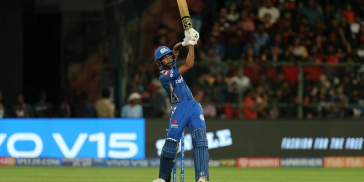 Hardik Pandya hits a six against Royal Challengers Bangalore at M Chinnaswamy Stadium in Bangalore