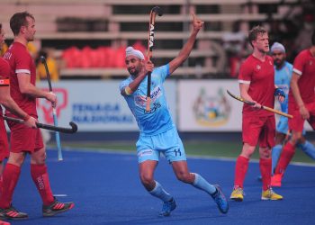 Mandeep Singh celebrates after scoring a hat-trick against Canada in Ipoh, Malaysia, Wednesday