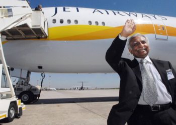 Jet Airways founder Naresh Goyal waves in front of a taxied Aircraft. (AFP)