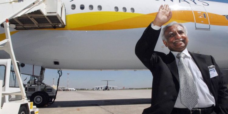 Jet Airways founder Naresh Goyal waves in front of a taxied Aircraft. (AFP)