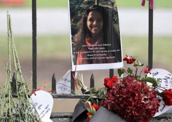 Tribute of a victim of mosque shooting, Ancia Alibava from Kerala, hangs on a wall at the Botanical Gardens in Christchurch, New Zealand. (AP)
