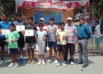 Winners and runners-up in various categories of AITA OTA TS7 tennis tournament pose with their trophies and certificates along with guests in Bhubaneswar, Friday