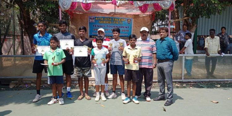 Winners and runners-up in various categories of AITA OTA TS7 tennis tournament pose with their trophies and certificates along with guests in Bhubaneswar, Friday