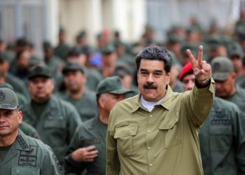 Venezuelan President Nicolas Maduro (showing V sign) has the support of the army