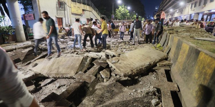 Rescue work in progress after a foot overbridge near CST station collapsed in Mumbai. (PTI)