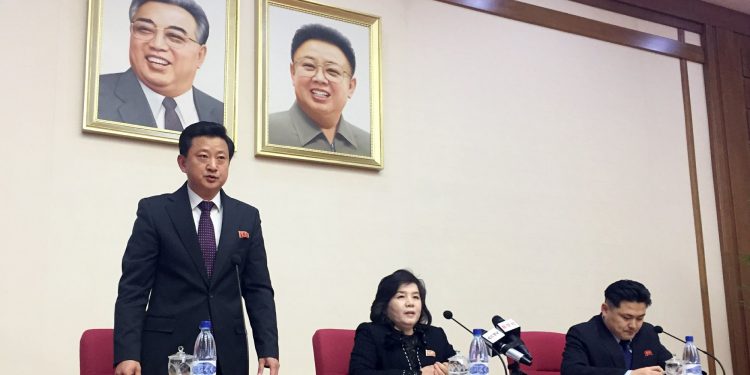 North Korean Vice Foreign Minister Choe Son Hui, center, speaks at a gathering for diplomats in Pyongyang, North Korea on Friday, March 15, 2018. North Korean leader Kim Jong Un will soon make a decision on whether to continue diplomatic talks and maintain the country's moratorium on missile launches and nuclear tests, the senior North Korean official said, noting the U.S. threw away a golden opportunity at the recent summit between their leaders. Interpreter is on Choe's right and the man standing is unidentified vice director of foreign ministry’s North America desk. (AP Photo/Eric Talmadge)