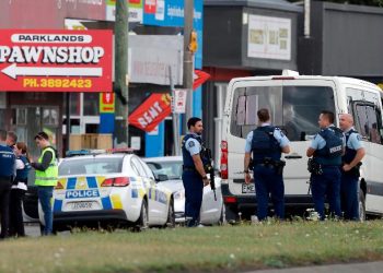 Police stand outside a mosque in Linwood, Christchurch, New Zealand, Friday, March 15, 2019. Multiple people were killed during shootings at two mosques full of people attending Friday prayers. (AP Photo/Mark Baker)