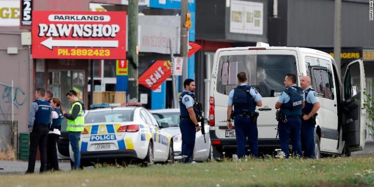 Police stand outside a mosque in Linwood, Christchurch, New Zealand, Friday, March 15, 2019. Multiple people were killed during shootings at two mosques full of people attending Friday prayers. (AP Photo/Mark Baker)
