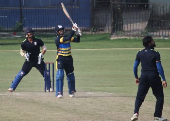 Wriddhiman Saha hits a six against Odisha in Cuttack, Saturday    