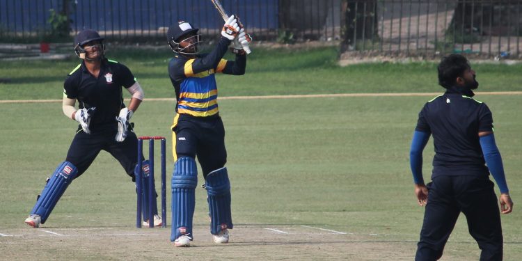 Wriddhiman Saha hits a six against Odisha in Cuttack, Saturday    