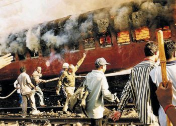 Coach S-6 carrying Hindu pilgrims is engulfed in flames at Godhra, a Muslim-dominated area in the western state of Gujarat. (AFP)