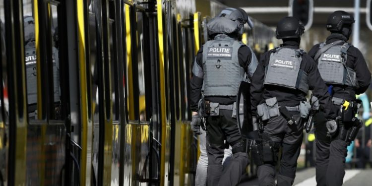 Armed police and emergency services swarmed the scene after the shooting in the city of Utrecht (AFP)