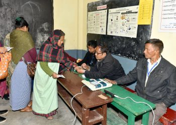 A polling official administering indelible ink to a voter, at a polling booth, during the Meghalaya Assembly Election, in Shillong on February 27, 2018.