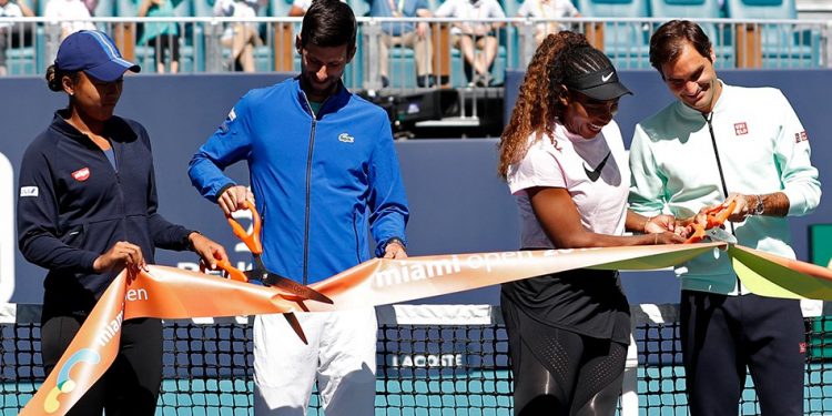 (L-R) Naomi Osaka of Japan, Novak Djokovic of Serbia, Serena Williams of the United States, and Roger Federer of Switzerland participate in a ribbon-cutting ceremony on new stadium court at Hard Rock Stadium prior to play in the first round of the Miami Open at Miami Open Tennis Complex. (Reuters)