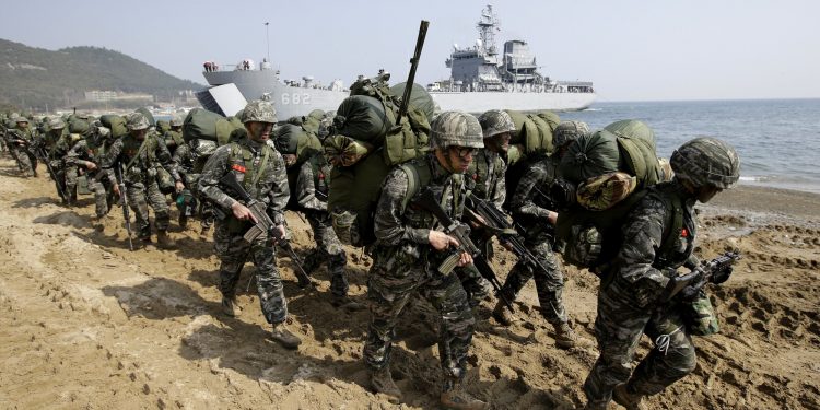 FILE - In this March 30, 2015, file photo, South Korean Marines march after landing on the beach during the U.S.-South Korea joint landing military exercises as a part of the annual joint military exercise Foal Eagle between South Korea and the United States in Pohang, South Korea. South Korea and the U.S. say they've decided to end their springtime military drills to back diplomacy with North Korea. (AP)