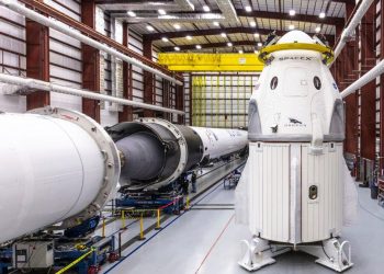 In this Dec. 18, 2018 photo provided by SpaceX, SpaceX's Crew Dragon spacecraft and Falcon 9 rocket are positioned inside the company's hangar. (AP)