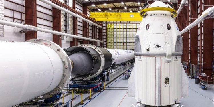 In this Dec. 18, 2018 photo provided by SpaceX, SpaceX's Crew Dragon spacecraft and Falcon 9 rocket are positioned inside the company's hangar. (AP)