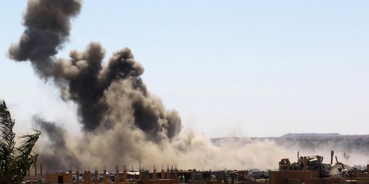 Smoke rises from the last besieged neighborhood in the village of Baghouz. (Image: Reuters)