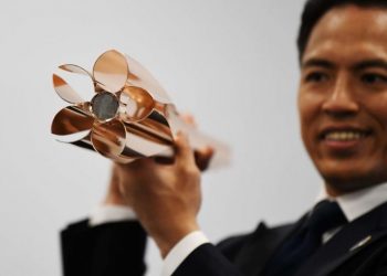 The shiny rose-gold torch, which is 71 centimetres (28 inches) long and weighs 1.2 kilograms (2 pounds 10 ounces). (Image: AFP)