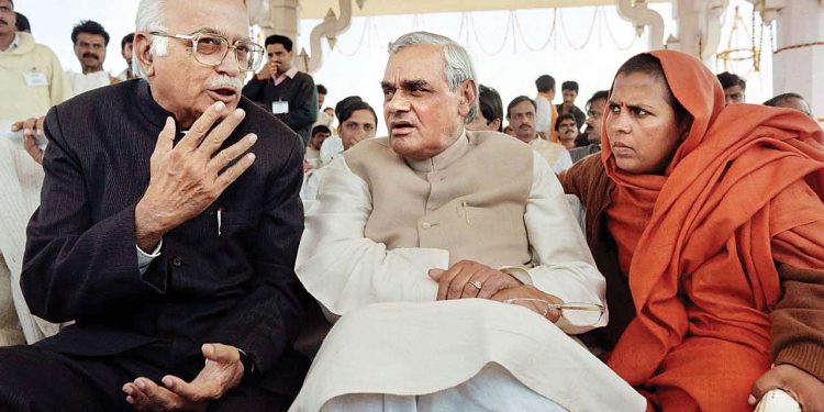 Veteran BJP leader LK Advani chats with former Prime Minister Atal Bihari Vajpayee as Uma Bharti looks on (PTI)