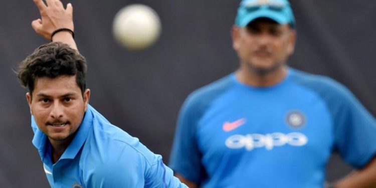  Kuldeep Yadav with India coach Ravi Shastri in the background (PTI)