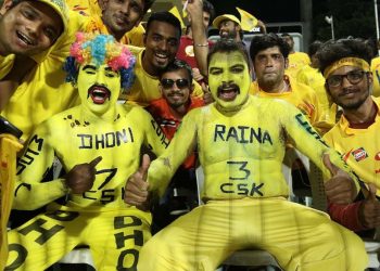 CSK fans cheer while being photographed. (PTI)