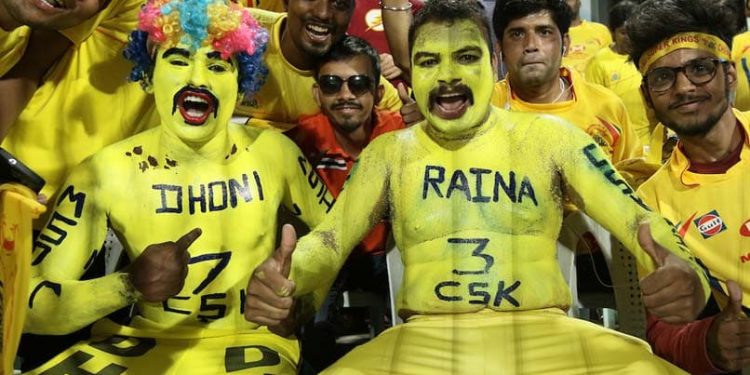 CSK fans cheer while being photographed. (PTI)