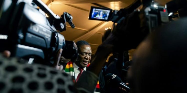 US President Donald Trump has prolonged sanctions on more than 100 individuals and entities from Zimbabwe including President Emmerson Mnangagwa, pictured, over rights abuses (AFP)