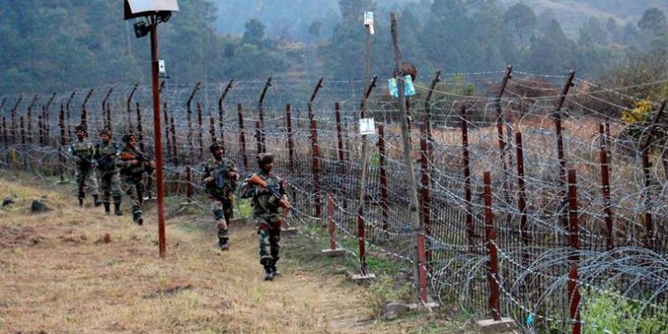 Poonch: Indian Army Soldiers stand guard near the Line of Control (LoC) in Poonch after One person was killed and many others injured in cross border firing between Indian and Pakistani troops on Thursday. PTI Photo(PTI6_3_2017_000079A)