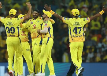 CSK players celebrate with Harbhajan Singh (centre) after the dismissal of Virat Kohli, Saturday