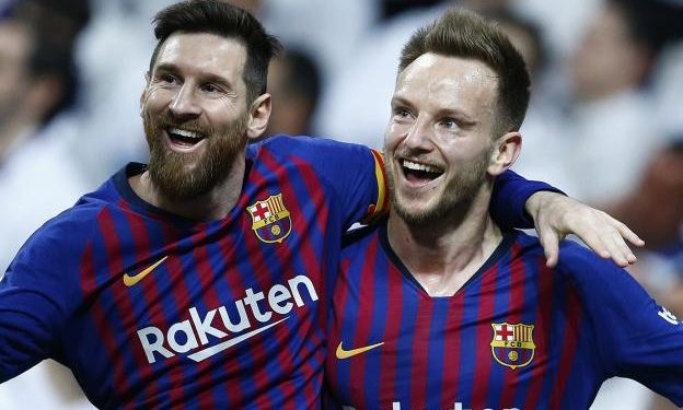 Barcelona’s Ivan Rakitic (R) and Lionel Messi celebrate after the former’s goal against Real Madrid in the La Liga game played Saturday