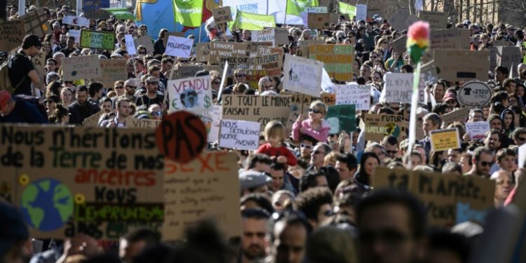 "Macron, you're screwed: the pandas are in the street," said one placard at the Paris demonstration, addressing French President Emmanuel Macron