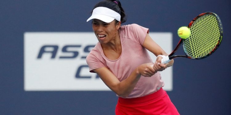 Hsieh Su-wei plays a backhand during her match against Naomi Osaka in Miami, Saturday