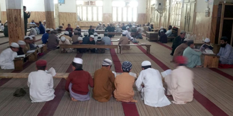 Students recite Koran at a madrasa near an impact site, after Indian military aircrafts struck February 26, according to Pakistani officials, during a trip to Jaba village, near Balakot (Pakistan) Wednesday REUTERS PHOTO