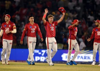 Sam Curran along with team members celebrates after their victory against Delhi Capitals at Mohali, Monday