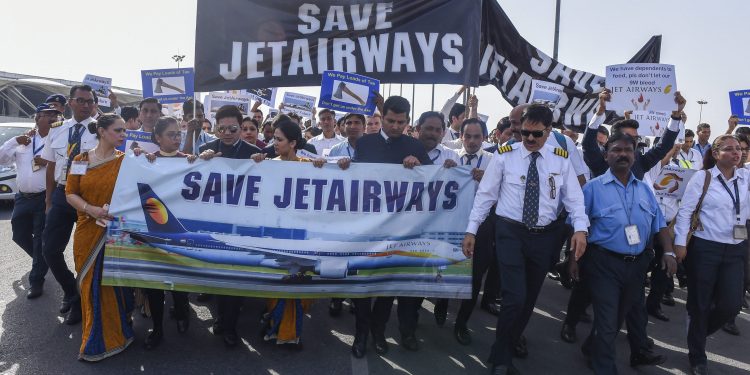 New Delhi: Jet Airways employees stage a protest over delay in their salaries at T-3 terminal of IGI Airport in New Delhi, Saturday, April 13, 2019. (PTI Photo/Atul Yadav)  (PTI4_13_2019_000095B)