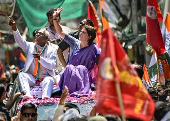 Jhansi: Congress General Secretary Priyanka Gandhi Vadra waves at the supporters during an election campaign roadshow in support of the  party candidate Shiv Sharan Kushwaha (L), in Jhansi, Thursday, April 25, 2019. (Twitter/PTI Photo)  (PTI4_25_2019_000081B)