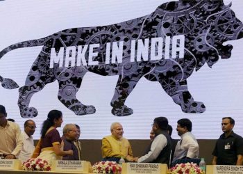A make in India logo is displayed in the backdrop at a conclave in August 2017. (PTI)