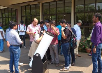 Students looking at 10 inch reflecting telescope at Institute of Physics in Bhubaneswar, Sunday