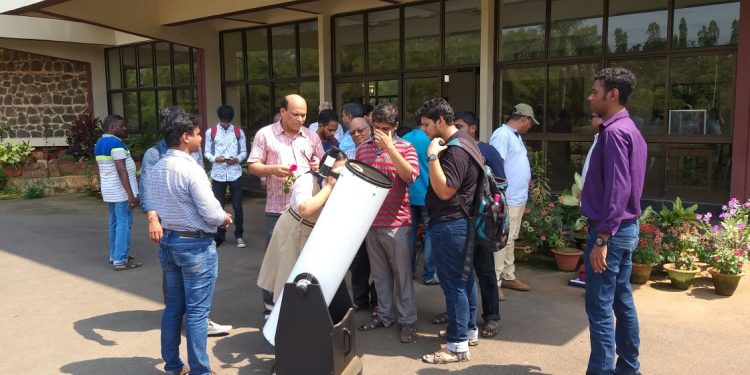 Students looking at 10 inch reflecting telescope at Institute of Physics in Bhubaneswar, Sunday