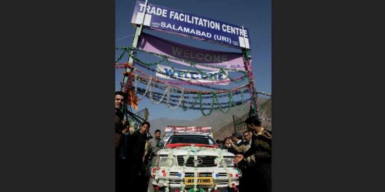 A vehicle begins driving to Pakistan-administered Kashmir during cross-border trade at Salamabad, 107km (66 miles) west of Srinagar, October 21, 2008. REUTERS/Danish Ismail/File Photo