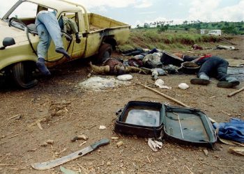 Dead Rwandans lie along the side of the road, some 70 kilometers north of the Rwanda-Tanzania border, May 8, 1994
