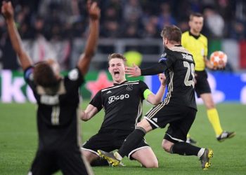 Ajax Amsterdam players celebrate their victory over Juventus in the Champions League quarterfinals, Saturday