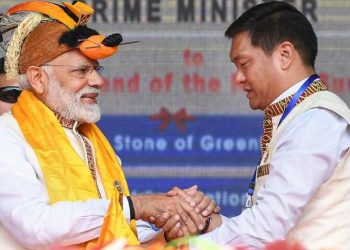 Arunachal Pradesh Chief Minister Pema Khandu shakes hands with PM Modi at the inauguration of several development projects. Itanagar, February 2019. (PTI)