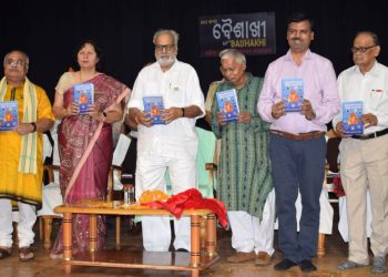 Governor Ganeshi Lal unveils a book on Shirdi Sai Baba by Pradeep Kumar Chaudhury  at Baisakhi Utsav in Bhubaneswar, Monday