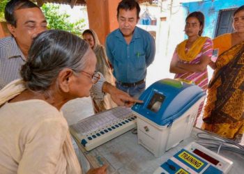 Election officials demonstrate the functioning of EVM and VVPAT for voters (PTI)