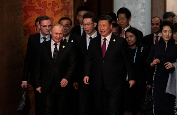 Russian President Vladimir Putin and Chinese President Xi Jinping arrive for a welcoming banquet at the Great Hall of the People in Beijing, China (File pic)