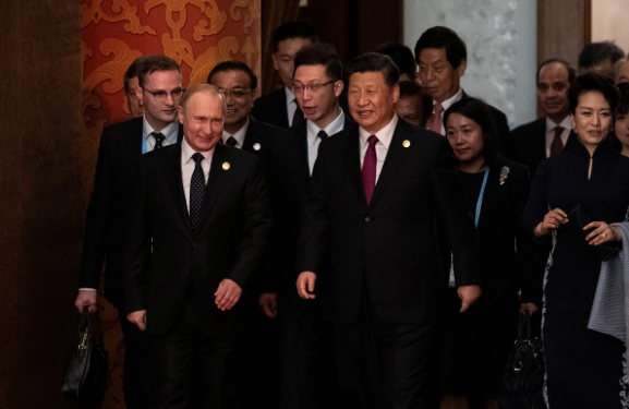 Russian President Vladimir Putin and Chinese President Xi Jinping arrive for a welcoming banquet at the Great Hall of the People in Beijing, China